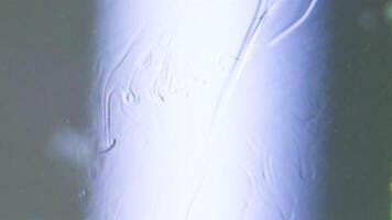 White background. Stock footage. A white heavy liquid that spreads , but in it , because of the density , different patterns can be seen . video