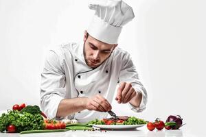 Chef Cutting Vegetables on Plate photo