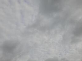 Beautiful grey clouds on sky background. Large bright soft fluffy clouds are cover the entire sky. photo