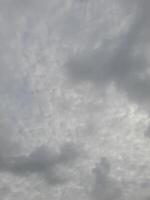 Beautiful grey clouds on sky background. Large bright soft fluffy clouds are cover the entire sky. photo
