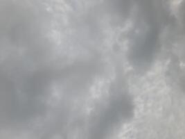 Beautiful grey clouds on sky background. Large bright soft fluffy clouds are cover the entire sky. photo