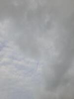 Beautiful grey clouds on sky background. Large bright soft fluffy clouds are cover the entire sky. photo