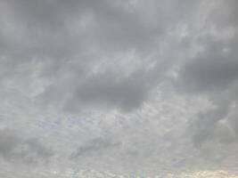 Beautiful grey clouds on sky background. Large bright soft fluffy clouds are cover the entire sky. photo