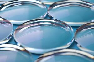Eyeglasses lens production industry, close-up eyeglasses lenses, eyeglasses lenses, eyeglasses lenses, eyeglasses store business concept photo