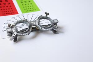 Glasses on chart in optical store photo