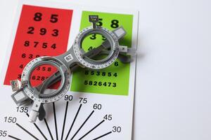 Glasses on chart in optical store photo