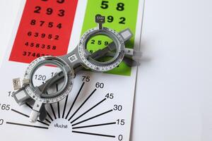 Glasses on chart in optical store photo