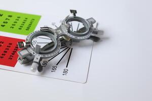 Glasses on chart in optical store photo