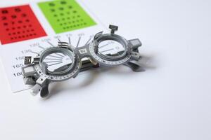 Glasses on chart in optical store photo