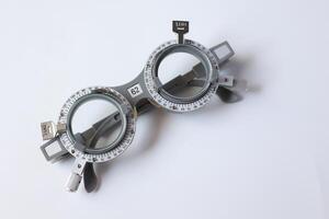 Glasses on chart in optical store photo
