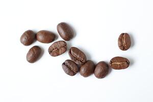 Bean isolated on white, brown roasted coffee beans on white photo