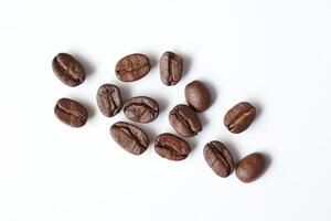 Bean isolated on white, brown roasted coffee beans on white photo