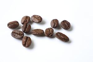 Bean isolated on white, brown roasted coffee beans on white photo