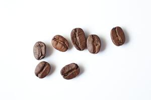 Bean isolated on white, brown roasted coffee beans on white photo