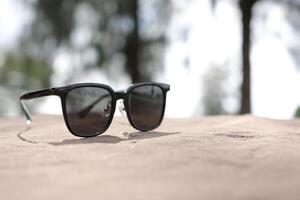 Sunglasses on the beach in summer photo