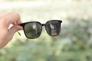 Sunglasses on the beach in summer photo