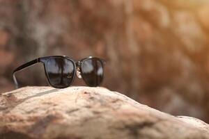 Sunglasses on the beach in summer photo