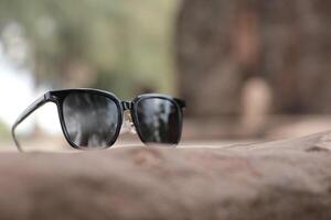 Sunglasses on the beach in summer photo
