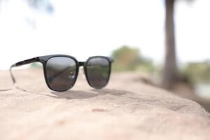 Sunglasses on the beach in summer photo