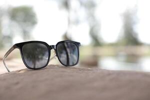 Sunglasses on the beach in summer photo