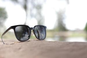 Sunglasses on the beach in summer photo