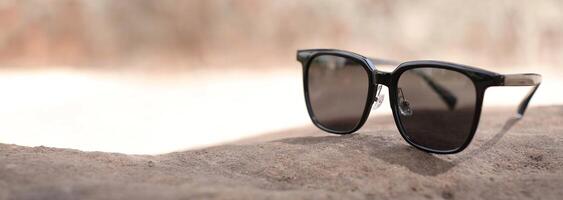 Sunglasses on the beach in summer photo
