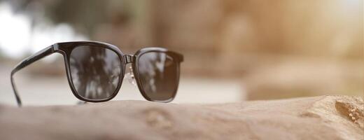 Sunglasses on the beach in summer photo
