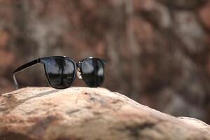 Sunglasses on the beach in summer photo