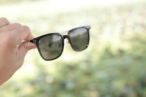 Sunglasses on the beach in summer photo