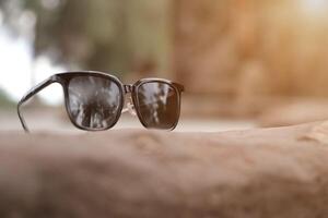 Sunglasses on the beach in summer photo