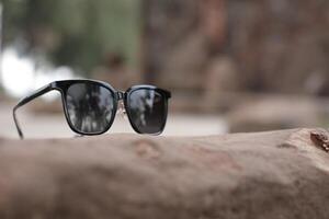 Sunglasses on the beach in summer photo