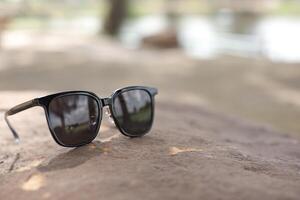 Sunglasses on the beach in summer photo