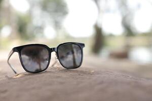 Sunglasses on the beach in summer photo