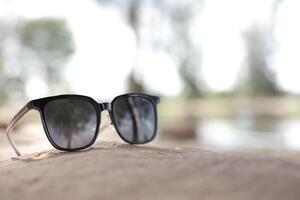 Sunglasses on the beach in summer photo