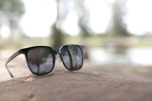 Sunglasses on the beach in summer photo