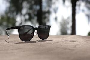 Sunglasses on the beach in summer photo