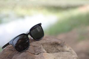 Sunglasses on the beach in summer photo