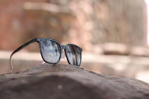 Sunglasses on the beach in summer photo