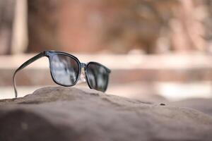 Sunglasses on the beach in summer photo