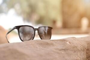Sunglasses on the beach in summer photo