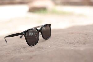 Sunglasses on the beach in summer photo