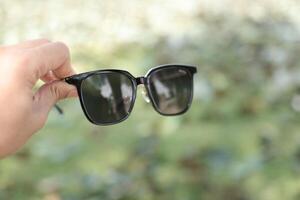 Sunglasses on the beach in summer photo