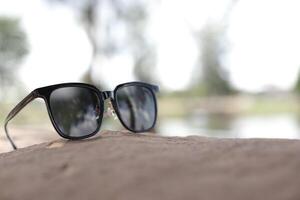 Sunglasses on the beach in summer photo