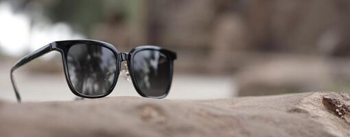 Sunglasses on the beach in summer photo