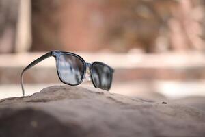 Sunglasses on the beach in summer photo