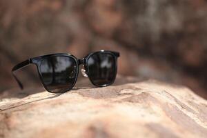 Sunglasses on the beach in summer photo