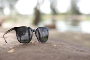 Sunglasses on the beach in summer photo