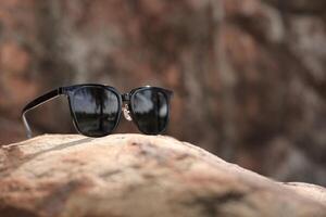 Sunglasses on the beach in summer photo