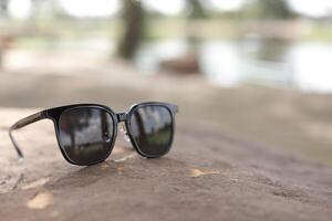 Sunglasses on the beach in summer photo