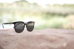 Sunglasses on the beach in summer photo